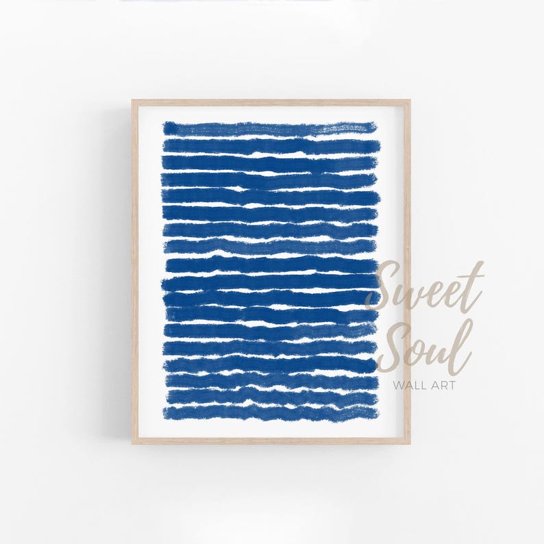 May include: Abstract art print featuring a blue and white colour scheme. The print displays a series of horizontal lines in a deep blue colour, creating a textured and modern look.