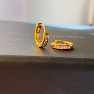 Small huggie hoop earrings. Gold huggie hoop earrings. Minimalist sterling silver hoop earrings. Pave Huggie Hoops with Cubic Zirconia.