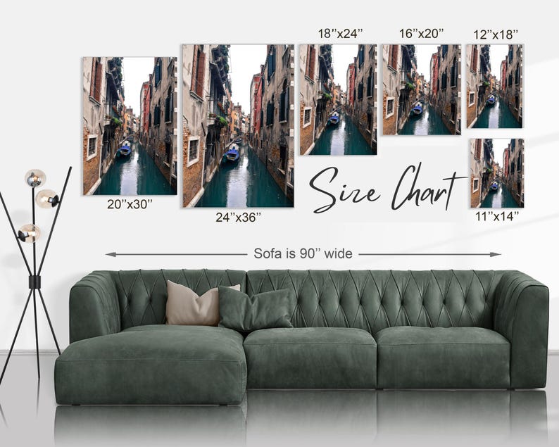 May include: Size chart for a canvas print of a canal in Venice, Italy. The chart shows different sizes of the print, ranging from 11 inches by 14 inches to 24 inches by 36 inches. The print features a narrow canal with buildings on either side and a gondola in the water.