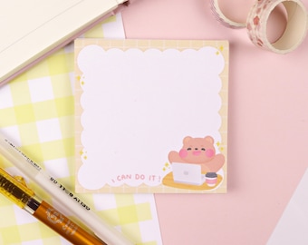 May include: A yellow and white checkered background with a sticky note featuring a cartoon bear sitting at a laptop with a cup of coffee. The sticky note has a scalloped border and the text "I can do it!" in a handwritten font.