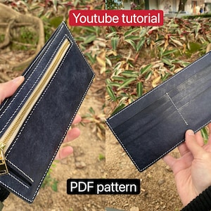 May include: Two different views of a dark blue leather wallet with white stitching. The wallet on the left has a gold zipper and the wallet on the right has multiple card slots. The text "Youtube tutorial" and "PDF pattern" are visible in the image.