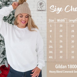 May include: A white crewneck sweatshirt with a size chart. The chart lists sizes S to 4XL, with measurements in inches for width, length, and sleeve length. The sweatshirt is a Gildan 18000 Heavy Blend.