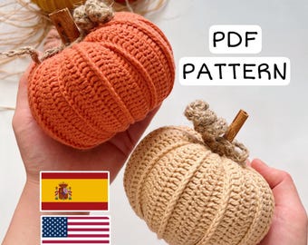 May include: Crocheted pumpkins in shades of orange, tan, and yellow, with cinnamon stick stems and twine accents. The image includes the text "PDF PATTERN". Perfect for fall decor or crafting projects.