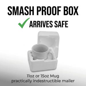 May include: A white ceramic mug nestled inside a two-piece white polystyrene foam protective packaging. The text reads SMASH PROOF BOX, ARRIVES SAFE, and 11oz or 15oz Mug practically indestructible mailer, with a green checkmark icon.