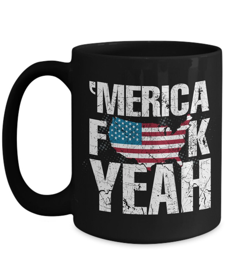 May include: A black ceramic mug featuring a distressed white graphic with the text 'MERICA F*CK YEAH and a central silhouette of the United States map filled with the American flag pattern of red, white, and blue stripes and white stars.