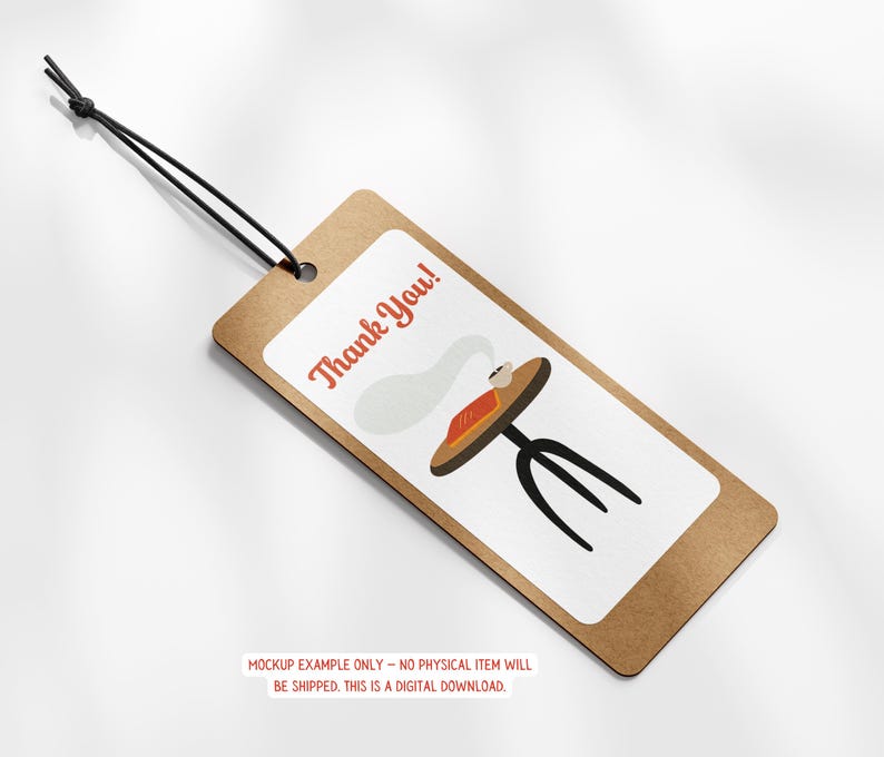 May include: A brown tag with a white rectangle featuring a cartoon table with a book and steam, and the words "Thank You!" in red. The tag is attached to a black string.