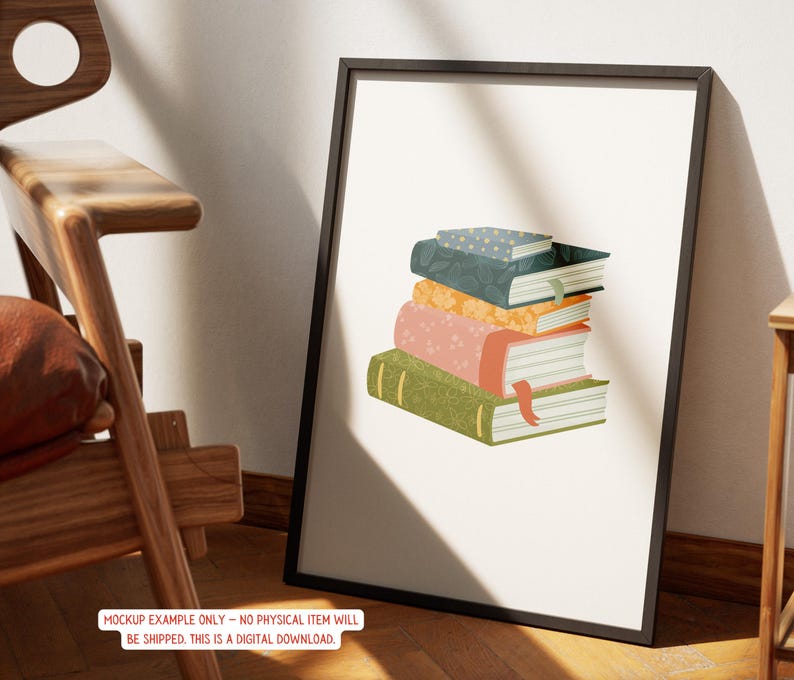 May include: A framed art print featuring a stack of illustrated books. The books are in various colors, including green, pink, orange, and blue, with decorative patterns and bookmarks. The frame is black, and the print is displayed against a neutral background.