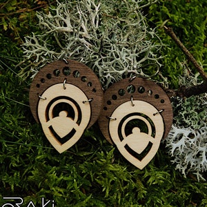 Geometric laser cut earrings in wood and steel