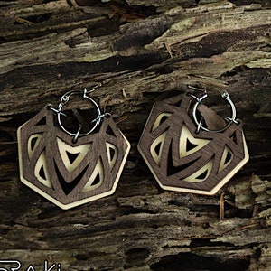 Geometric laser cut earrings in wood and steel