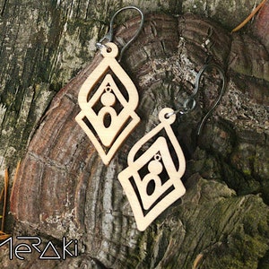 Geometric laser cut earrings in wood and stainless steel
