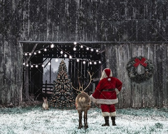 May include: A festive scene featuring Santa Claus in a red suit and a reindeer standing in front of a rustic barn. A Christmas tree, a wreath, and a rabbit are also visible, creating a holiday atmosphere.