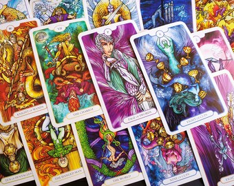 May include: A spread of tarot cards with colorful illustrations and gold accents. The cards include Knight of Wands, Ten of Pentacles, The Hanged Man, The Chariot, The World, Page of Swords, Nine of Cups, Eight of Cups, and Eight of Wands.