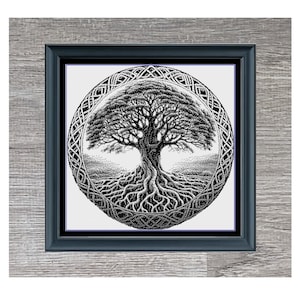 May include: Black and white cross-stitch pattern of a tree of life with intricate details. The pattern is framed in a black frame with a wood-grain background. The text "Tree Of Life Monochrome" and "324 x 318" are below the image.
