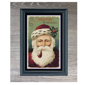 Puede incluir: Una tarjeta de Navidad vintage con un retrato de Santa Claus con un gorro rojo, barba blanca y pipa. La tarjeta tiene un fondo verde y azul con el texto "Christmas Greeting".