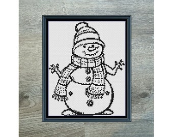 May include: Black and white cross stitch pattern of a snowman wearing a hat and scarf. The pattern is titled "Mini Snowman Monochrome" and is 89 stitches wide by 110 stitches tall. It uses 1 DMC color.