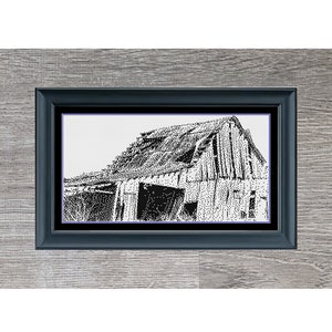 May include: Black and white artwork of a dilapidated barn, titled "Ramshackle Barn," framed in a dark blue frame. The artwork is set against a gray wooden background. The image is a detailed pen and ink style drawing.
