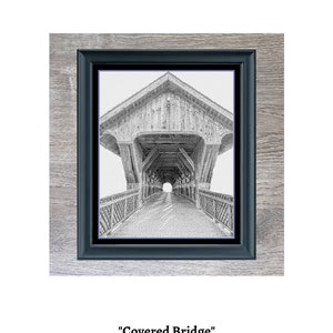 May include: Black and white illustration of a covered bridge with a wooden roof and railings. The bridge is framed in a black frame.