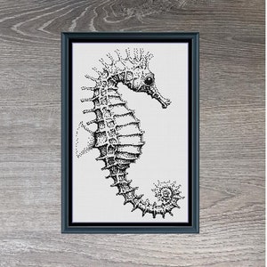 May include: Black and white cross-stitch pattern of a seahorse in a black frame on a woodgrain background. The pattern is titled "Little Seahorse" and measures 146 x 228 stitches.