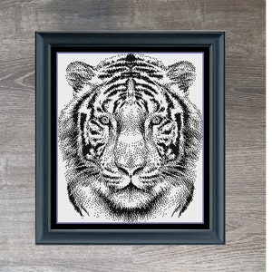 May include: Black and white illustration of a tiger's face in a black frame. The image is titled "Tiger Monochrome" and is credited to Stitching Jules Design.