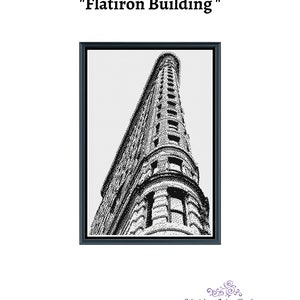 May include: Black and white illustration of the Flatiron Building in New York City. The building is depicted in a pixelated style, resembling a cross-stitch pattern.
