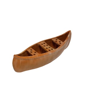 May include: A terracotta canoe-shaped planter with multiple drainage holes. The planter is a light brown colour and has a smooth, slightly glossy finish.
