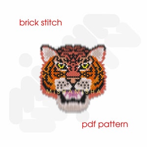 May include: A digital PDF pattern for a tiger head, created using the brick stitch technique. The tiger features orange, brown, and black beadwork with yellow eyes and an open mouth. The text "brick stitch", "MISHAMSHA", and "pdf pattern" are included.