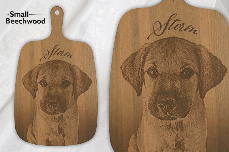 May include: A small wooden chopping board with a brown dog engraved on it. The dog's name, "Storm", is engraved above the dog's image.