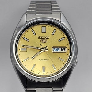 Seiko 5 7S26-0364 37mm Automatic Watch, English/spanish Calendar