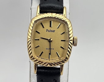 Beautiful Gold tone Pulsar by Seiko Ladies trank watch, gold tone case and dial, new black leather strap, New battery Works, Gift for her.