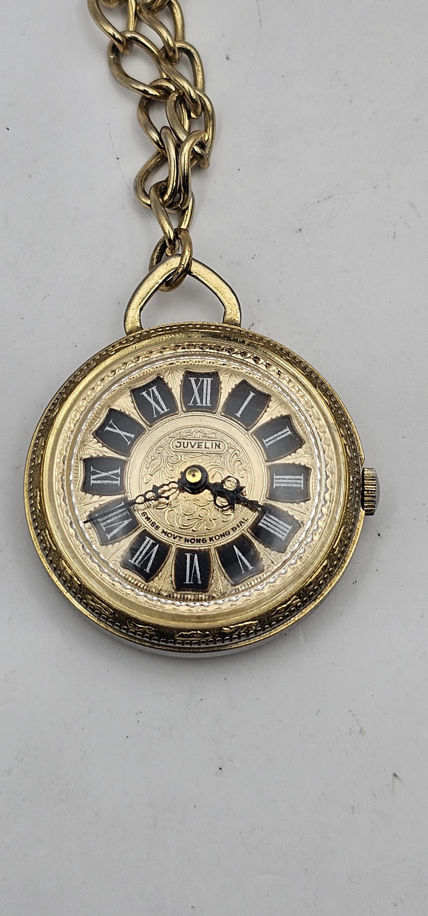 A Vintage Juvelin Roman Numeral Pocket Watch With Chain 