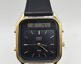 Reloj de hombre Timex vintage de 1994, de cuarzo, analógico-digital, con alarma y cronógrafo, color dorado, correa de cuero negro, batería nueva, ideal para regalar.
