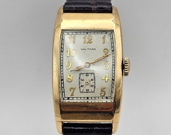 A Beautiful Vintage Waltman 1930s 10KGold Filled Tank watch subsecond and gold numeral dial, Running, Great collection Running