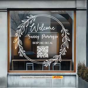 May include: White decal sticker with a floral wreath design and the text "Welcome Sunny Pimms Co. BESPOKE DECAL" and a QR code.