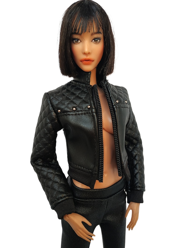 May include: A black leather jacket with a quilted design and silver studs. The jacket has a zipper closure and a cropped style.