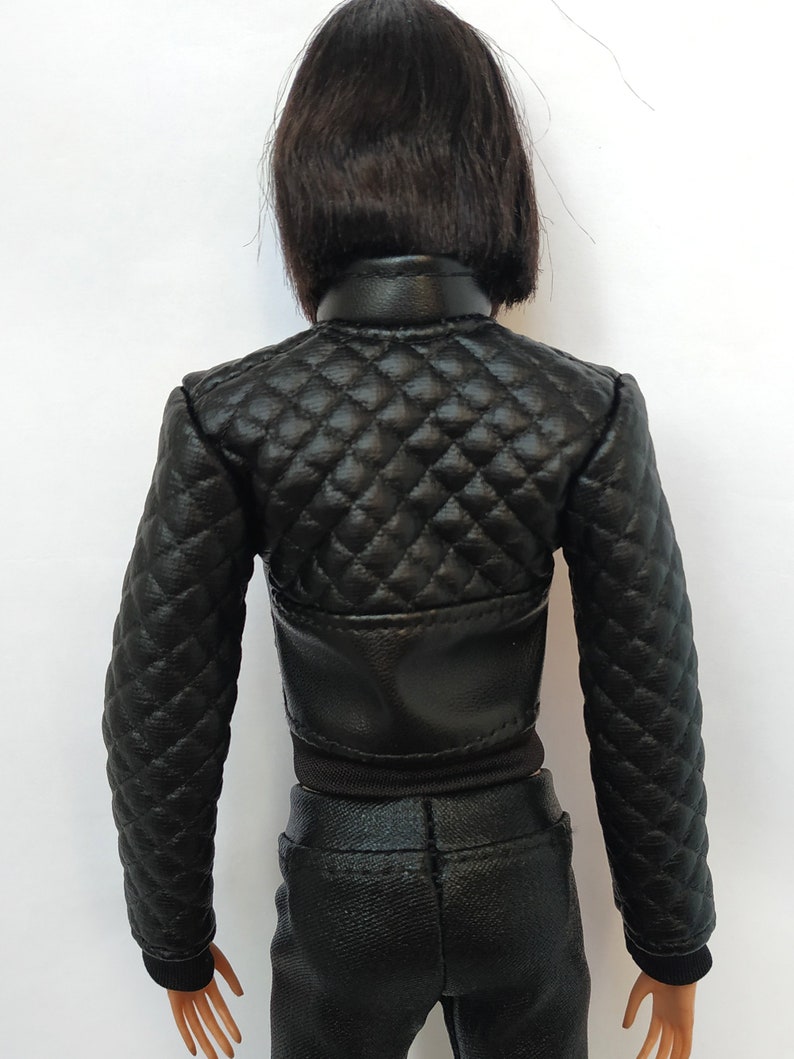 May include: Black quilted leather jacket with a zipper closure. The jacket has a diamond pattern and is cropped at the waist.