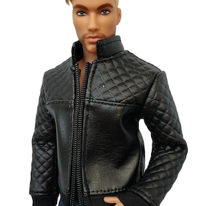 May include: A black quilted jacket with a zipper closure. The jacket has a stand-up collar and a diamond pattern.
