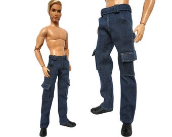 May include: Dark blue denim cargo pants with a belt and two side pockets. The pants are worn with black shoes. The doll is tan-skinned with blonde hair.
