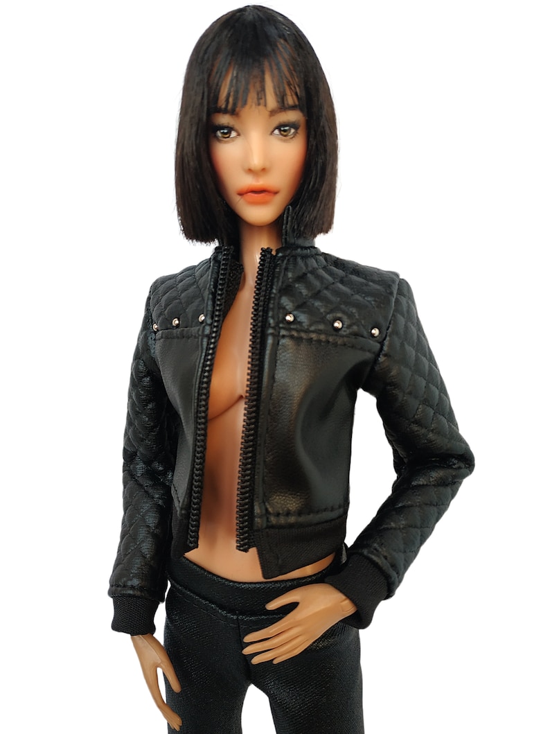 May include: A black leather jacket with a quilted design and silver studs. The jacket has a zipper closure and a ribbed knit collar, cuffs, and hem.