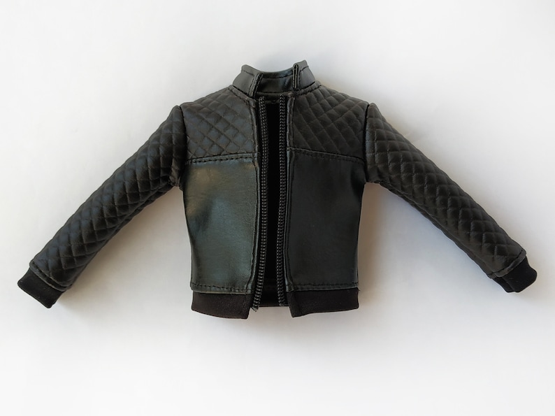 May include: A black quilted leather jacket with a zipper closure.
