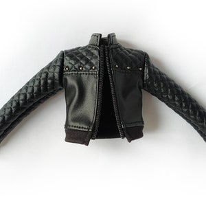 May include: Black quilted leather jacket with a zipper closure and silver studs.