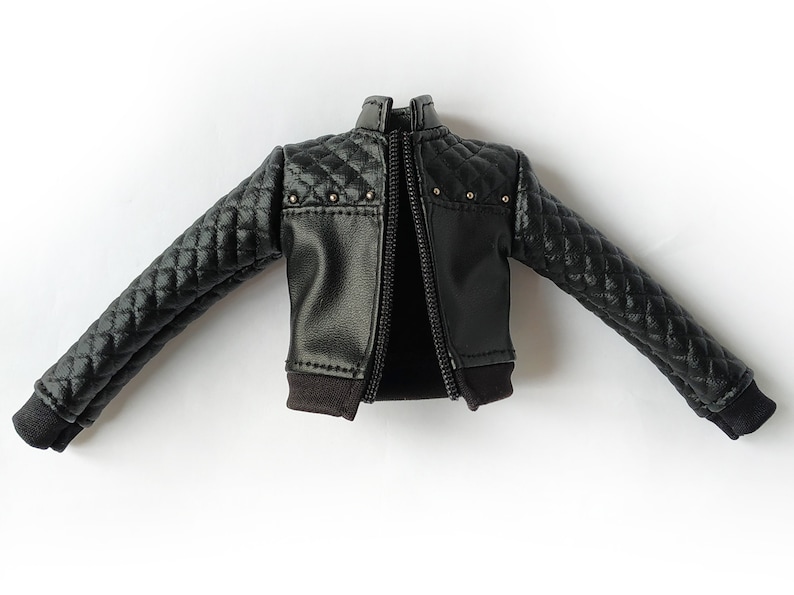 May include: Black quilted leather jacket with a zipper closure and silver studs.