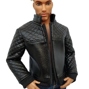 May include: A black quilted jacket with a zipper closure. The jacket has a stand-up collar and long sleeves.