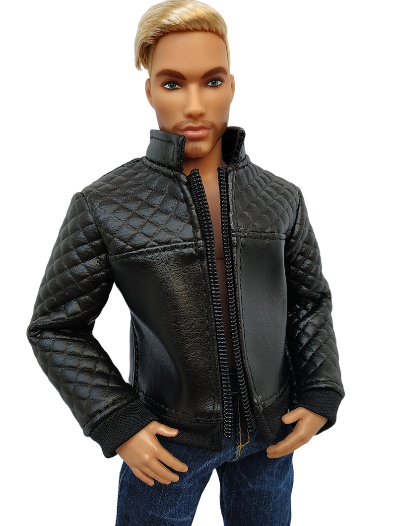 May include: A black quilted jacket with a zipper closure. The jacket has a stand-up collar and long sleeves.