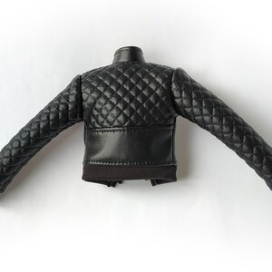 May include: Black quilted leather jacket with a zipper closure and ribbed cuffs.