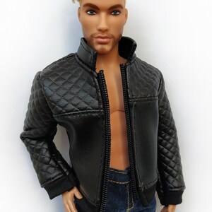 May include: A black quilted leather jacket with a zipper closure. The jacket has a stand-up collar and long sleeves.