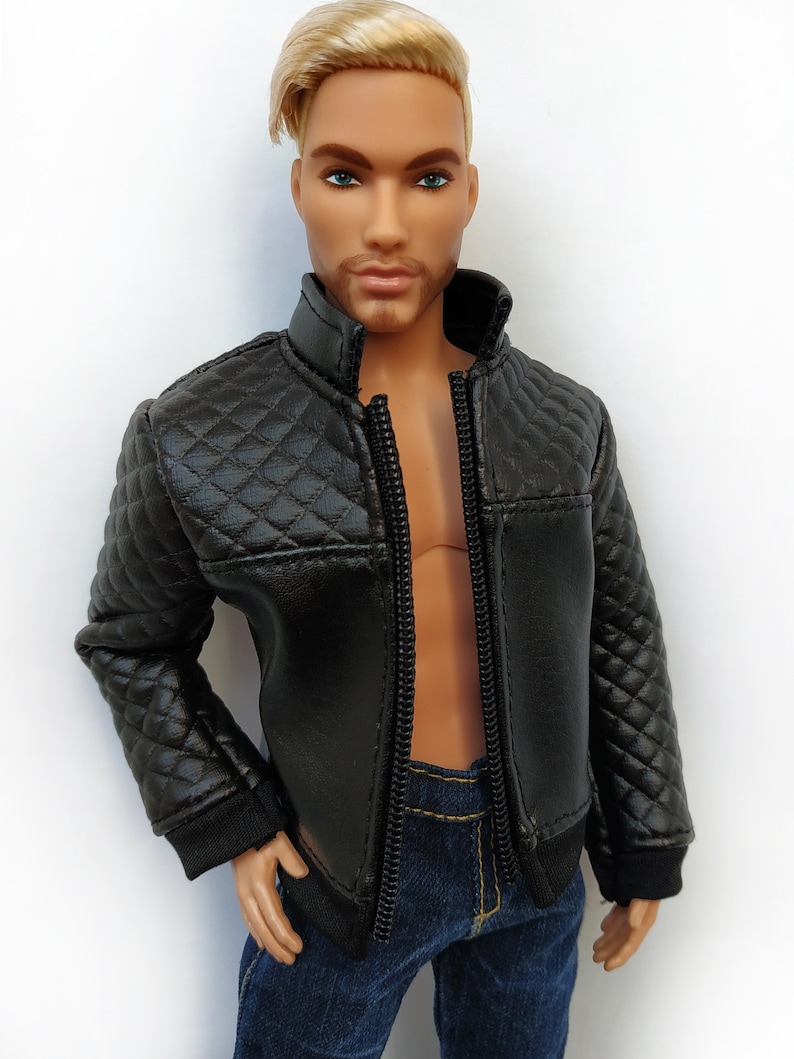 May include: A black quilted leather jacket with a zipper closure. The jacket has a stand-up collar and long sleeves.