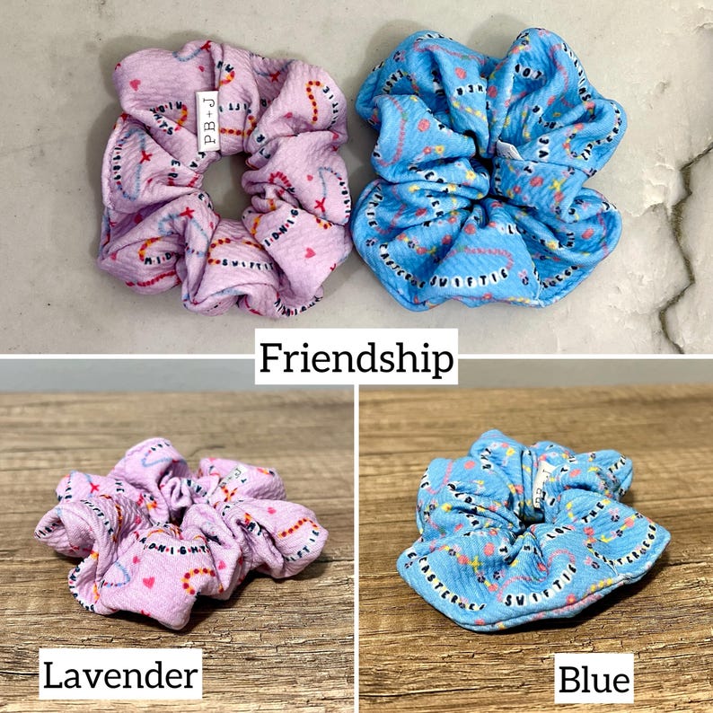 May include: Three scrunchies in different colors: lavender, blue, and a pink and blue combination. The scrunchies have a pattern of hearts and the text "Friendship" on them.