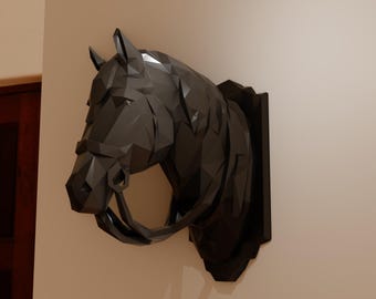 May include: A black geometric horse head sculpture mounted on a wall.