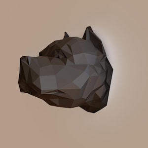 May include: A black and grey geometric 3D wall sculpture of a dog's head.