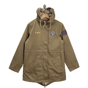 May include: Olive green hooded jacket with a Mickey Mouse design. The jacket features a hood, a front zipper, and multiple pockets. The jacket has a Mickey Mouse patch on the chest and a patch on the sleeve. The jacket is made of a durable material.